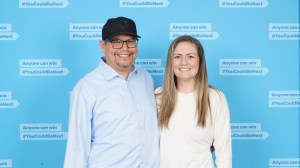 A man and woman pose for a photo.