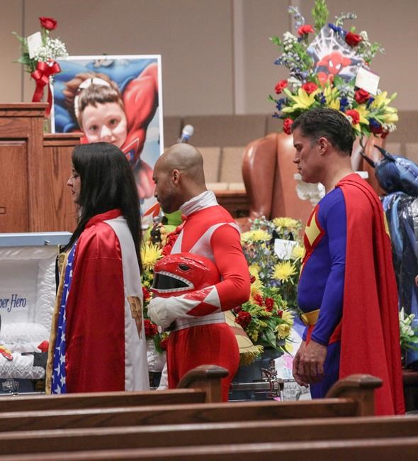 Superheroes honour school shooting victim dressed as Batman | iNFOnews.ca