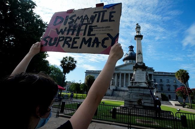 Protester: Man pulls gun on anniversary of flag’s removal | iNFOnews.ca
