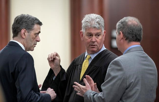 The Latest: Grisly and tender photos in dad's murder case | iNFOnews.ca