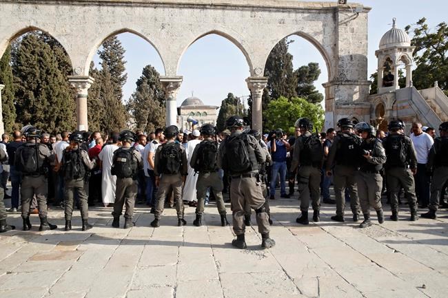 The Latest: More clashes after nightfall at Jerusalem site | iNFOnews.ca