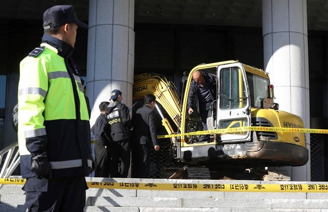 S Korea man rams office after woman in scandal detained | iNFOnews.ca S Korea man rams office after woman in scandal detained | iNFOnews.ca