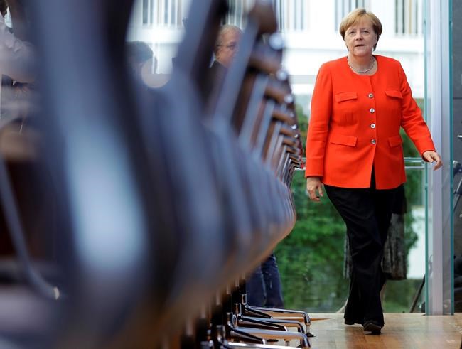 The Latest: Merkel open to idea of new eurozone minister | iNFOnews.ca