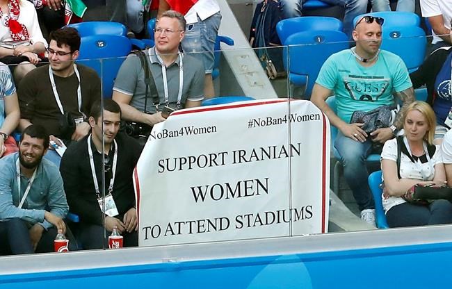 Iran fans unfurl banner at World Cup in support of women | iNFOnews.ca CP2021199648