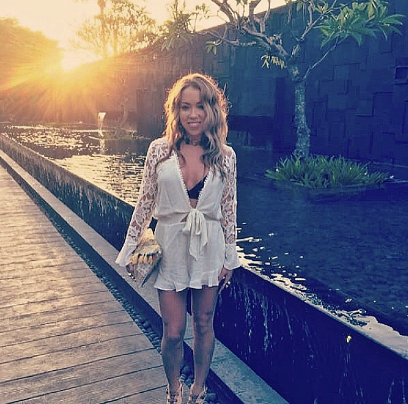 Kelowna philanthropist's short, cocaine-fuelled relationship cost him $5M after court battle | iNFOnews.ca Kaitlynn Fleury wears a white dress standing next to a pond.