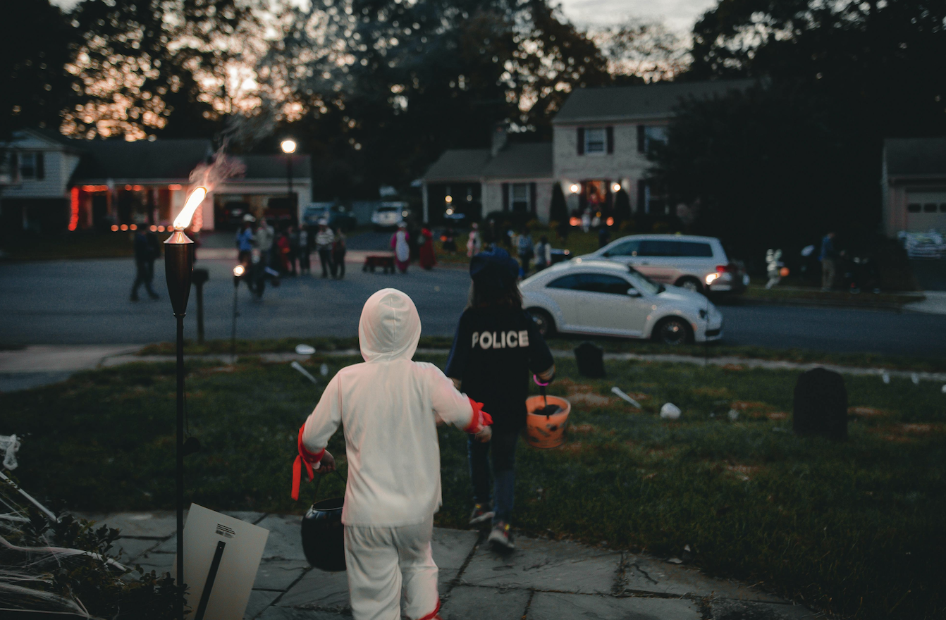 Children trick or treat on Halloween.