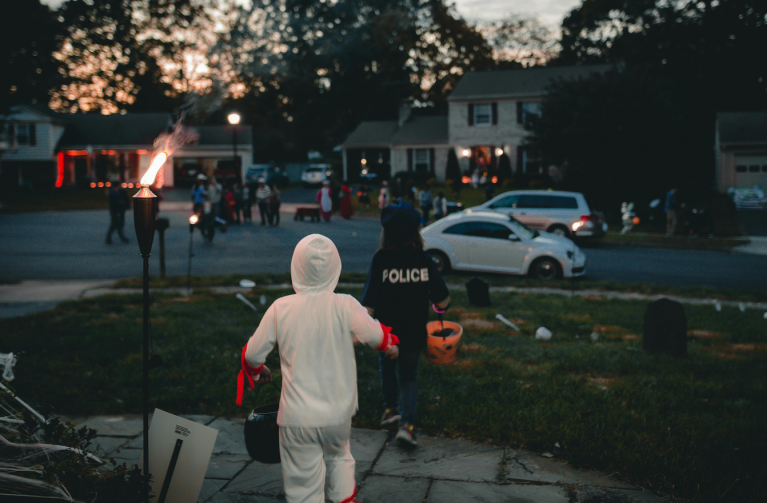 Children trick or treat on Halloween.