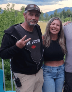 Timothy John Regan stands next to Katie Pasitney and other protesters at the Universal Ostrich Farm.