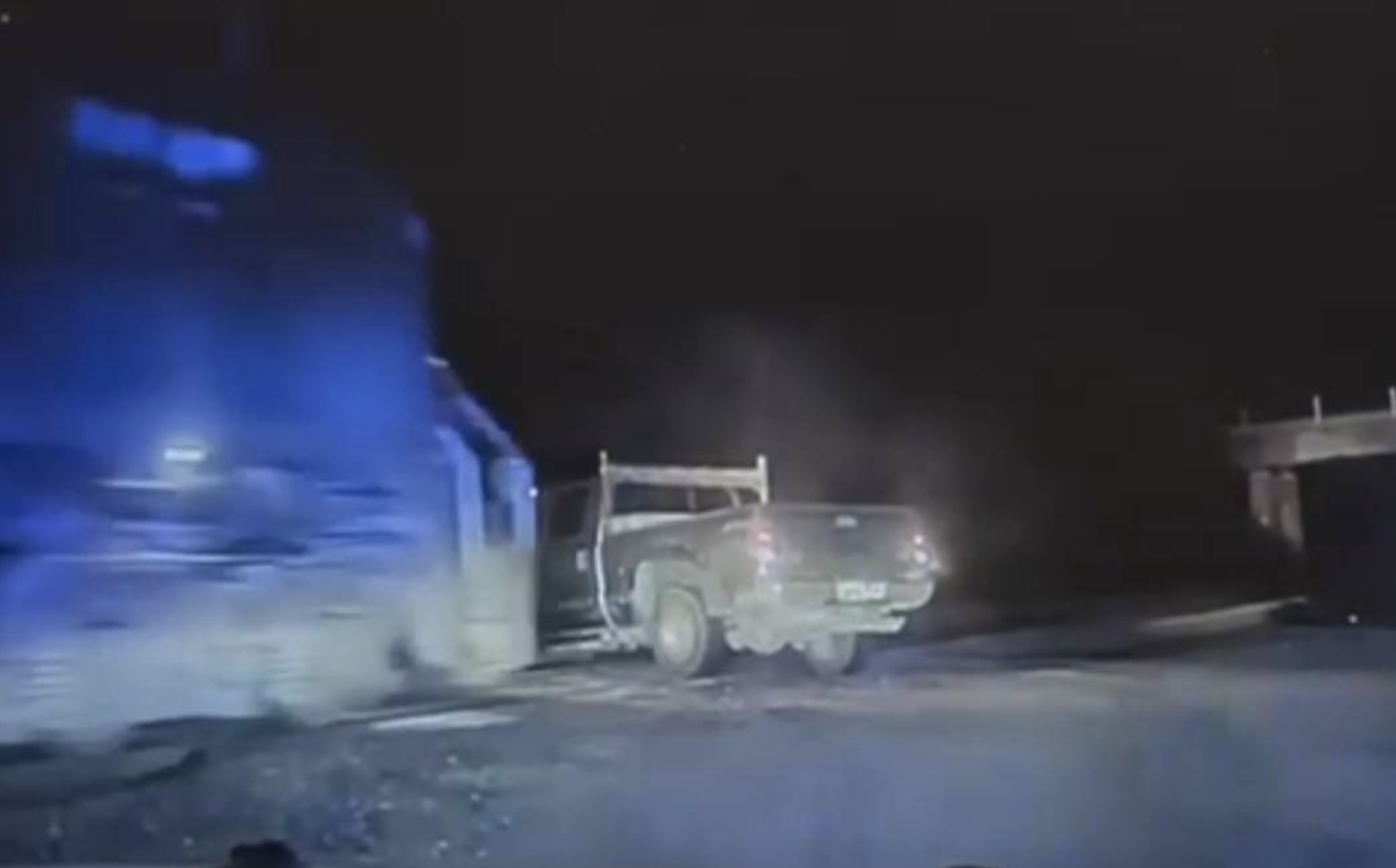 A train hitting a truck at night.
