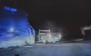 A train hitting a truck at night.