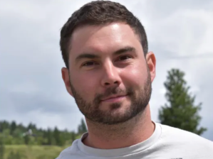 A headshot of Adam Briand-Lawrence.