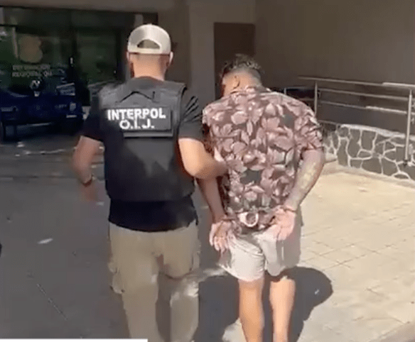 Accused Lake Country drug dealer Jesse Michael Valentino Bou-Saleh is escorted by Costa Rican police.