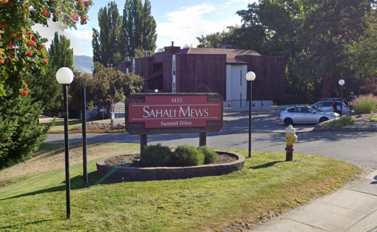 A sign outside a strata complex.