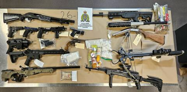 Weapons, drugs and cash seized during an RCMP raid.