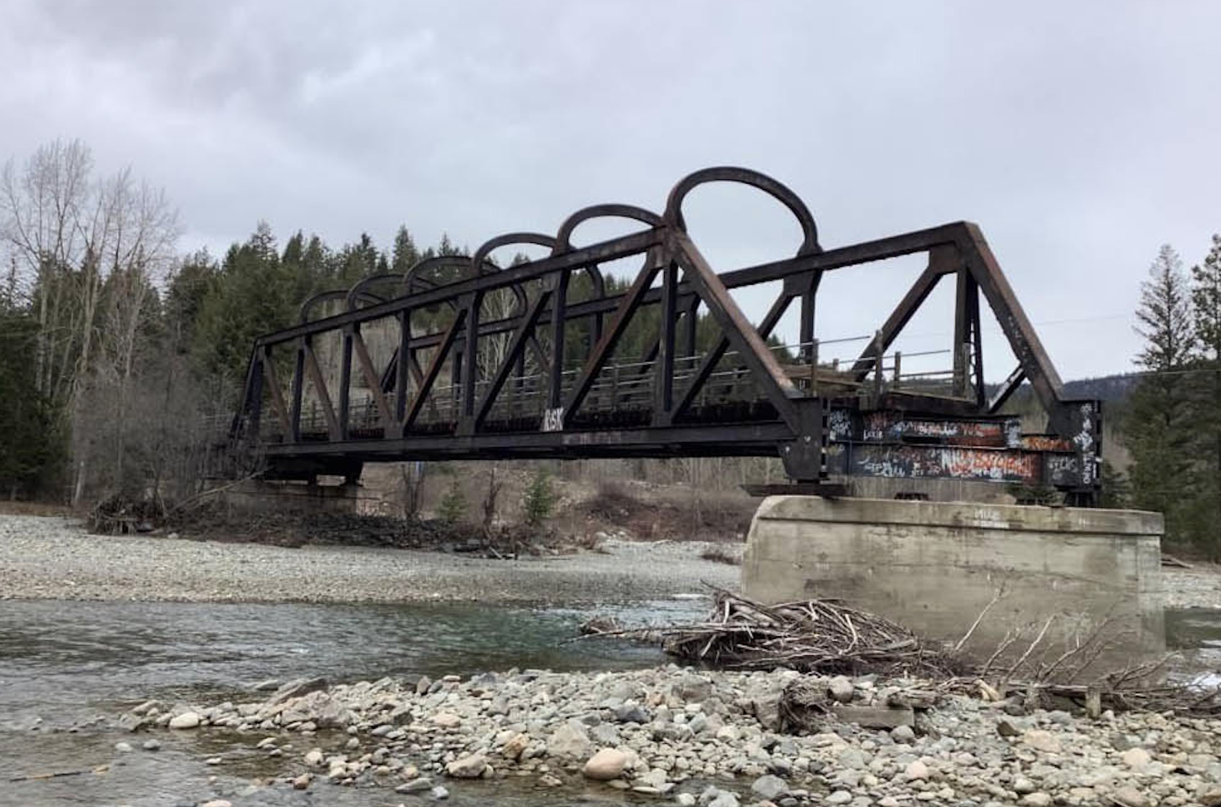 A bridge over a river broken in half.