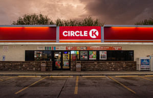 Dark clouds loom over a lit up Circle K convenience store.