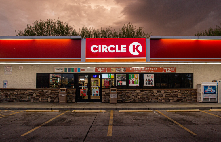 Dark clouds loom over a lit up Circle K convenience store.