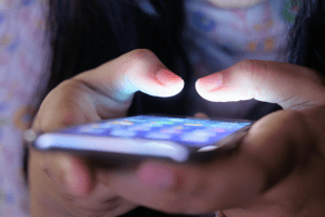 A person holding a smart phone.