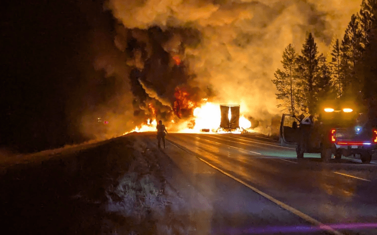 A fully engulfed semi trailer burns on the Coquihalla Highway.