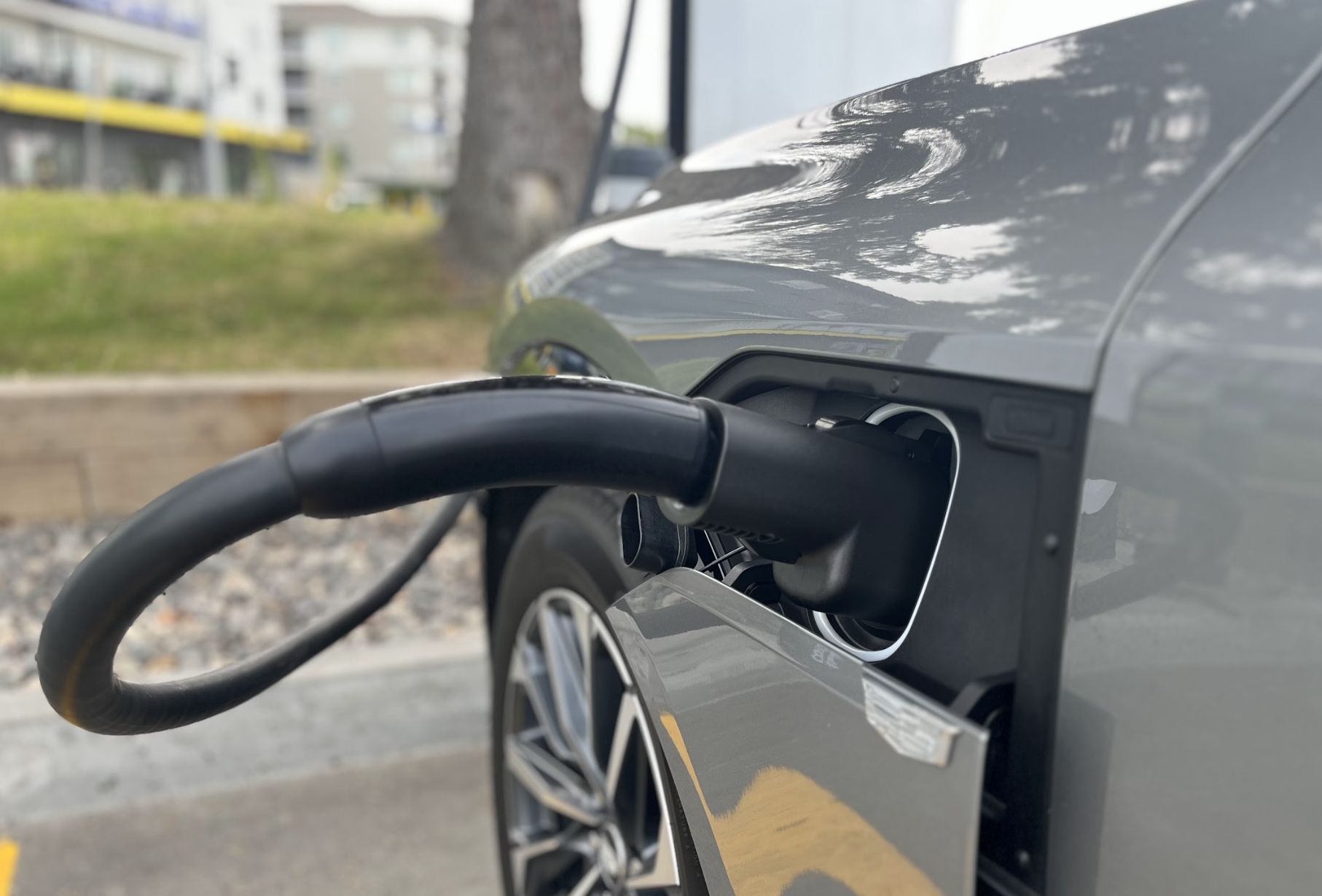 An electric vehicle at a charging station.