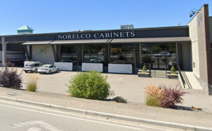 Cars parkd outside of the Norelco Cabinets building.