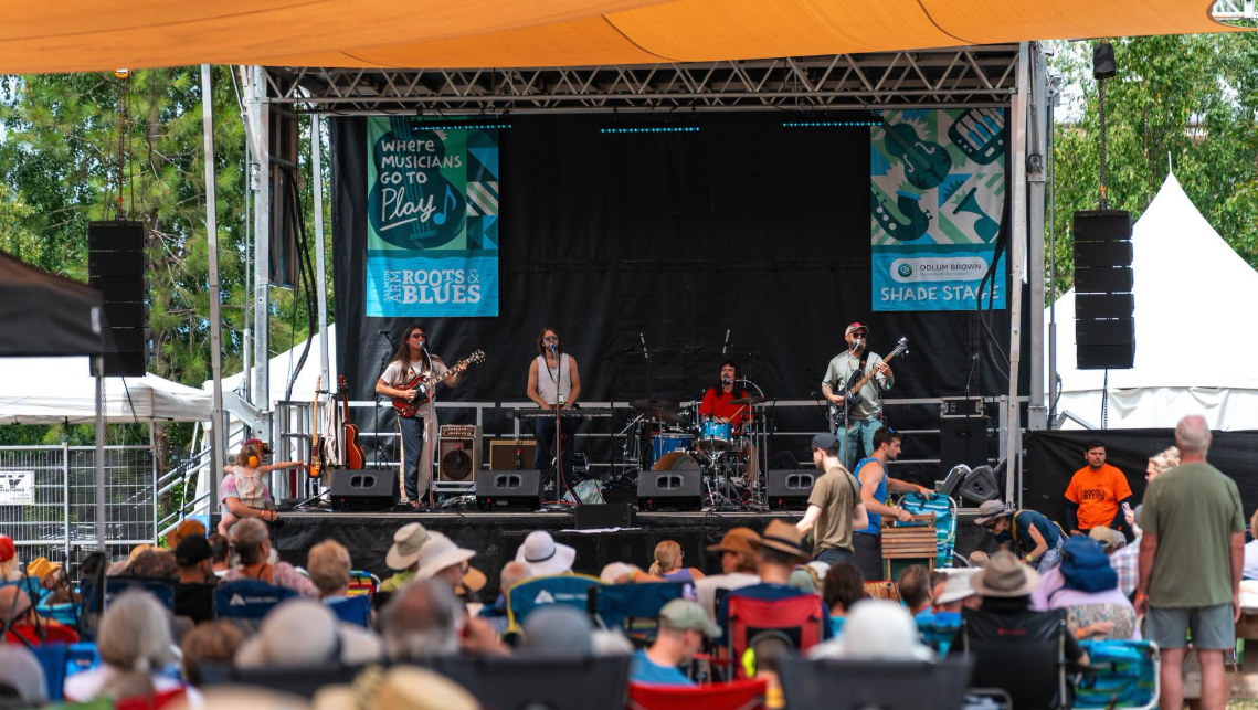 A band play on stages at the salmon arm roots and blues festival
