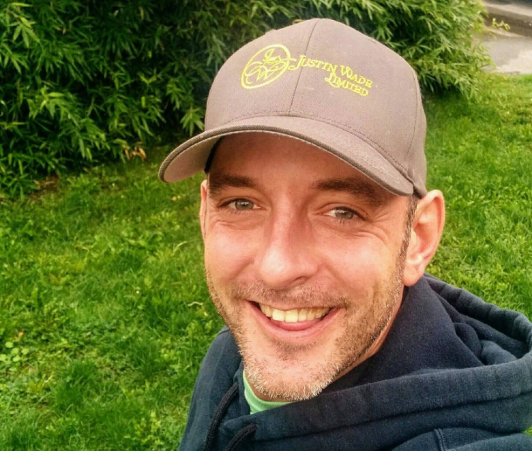 Bryan Miles wear a baseball cap.