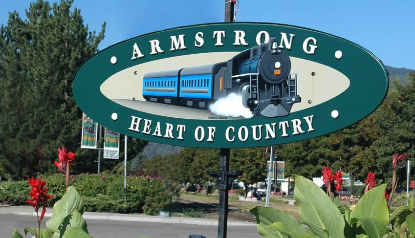 A train appears on a sign in the City of Armstrong.