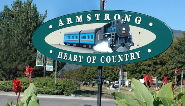 A train appears on a sign in the City of Armstrong.