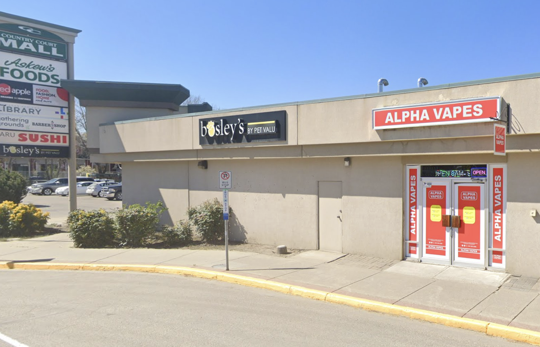A strip mall with a vape shop.
