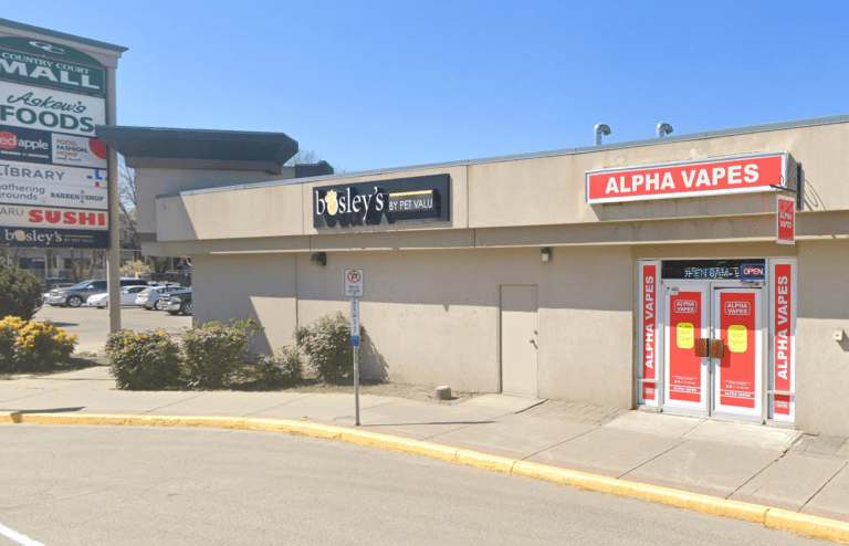 A strip mall with a vape shop.