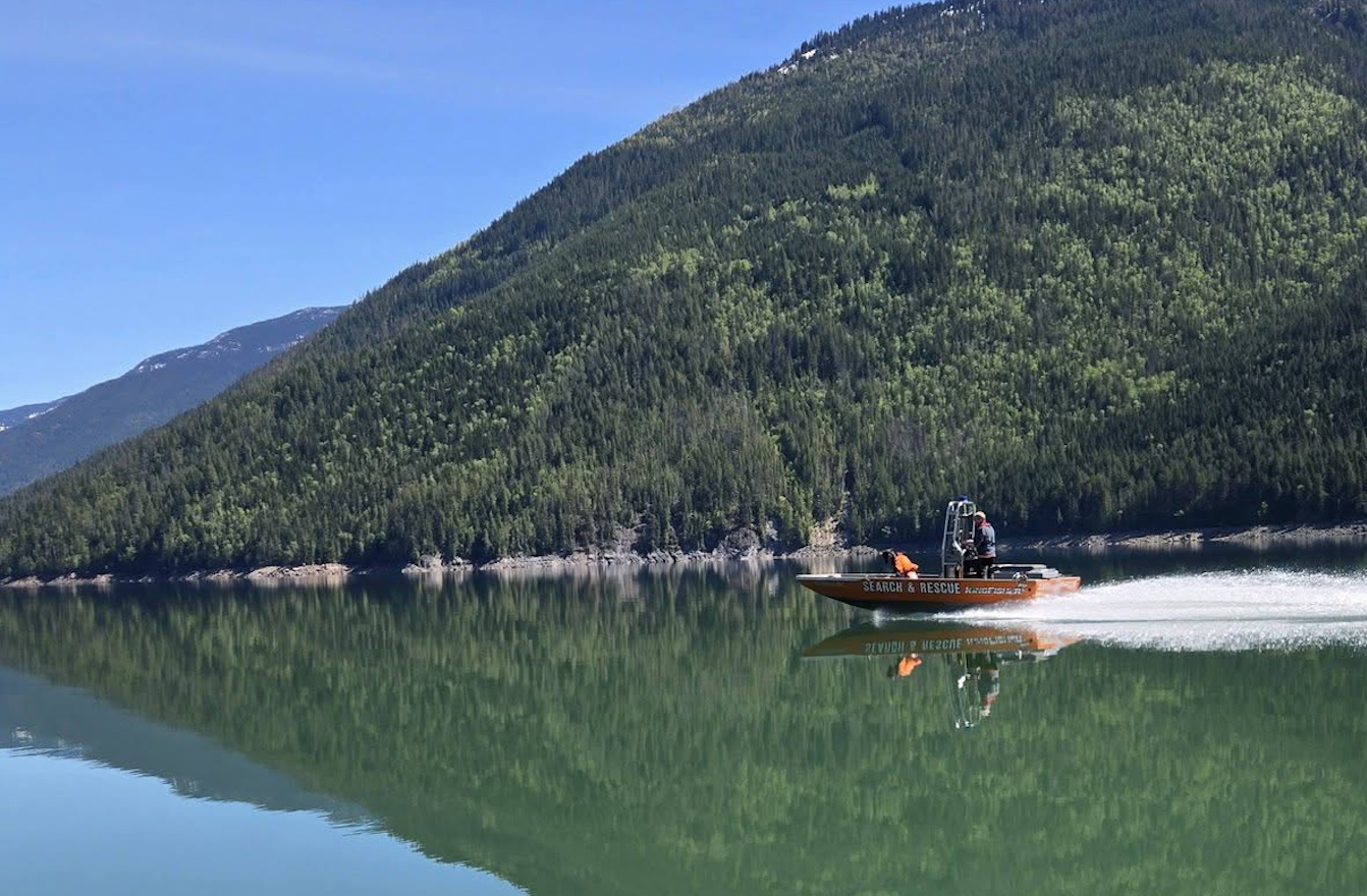 A search and rescue boat on a lake.