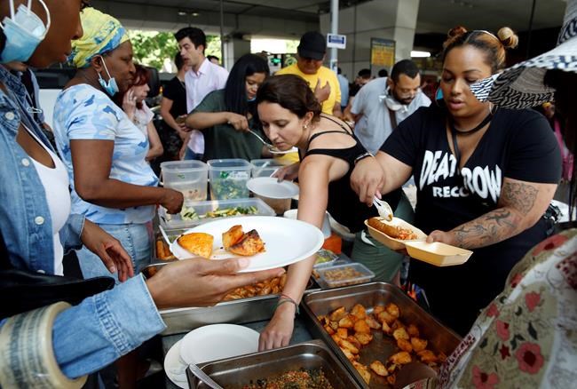 Diverse London neighbourhood unites in fire aftermath | iNFOnews.ca CP356842413
