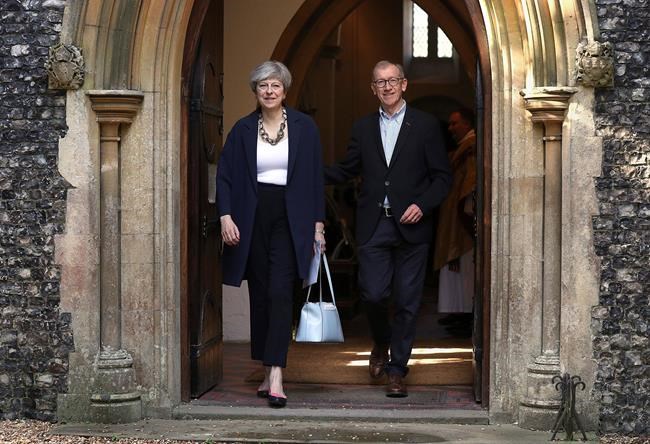 Tottering Theresa May names new UK Cabinet as critics circle | iNFOnews.ca