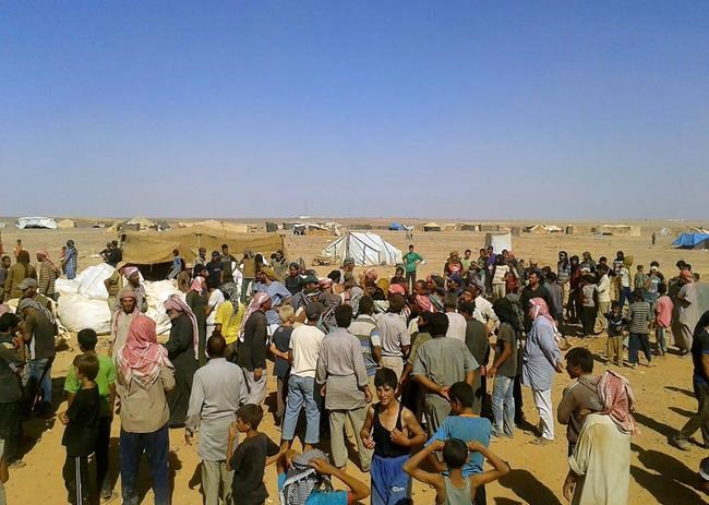 Access to food 'precarious' for Syrians stranded near Jordan | iNFOnews.ca CP822328312
