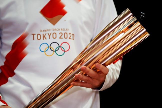 Tokyo Olympic torch relay: Masks, quiet cheering and caution | iNFOnews.ca