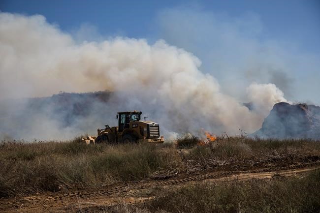 Israel strikes Gaza sites in response to airborne fire bombs | iNFOnews.ca CP74214532