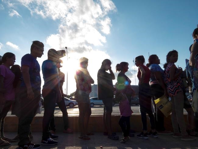 The Latest: Court ruling disrupts migrant family's hearing | iNFOnews.ca
