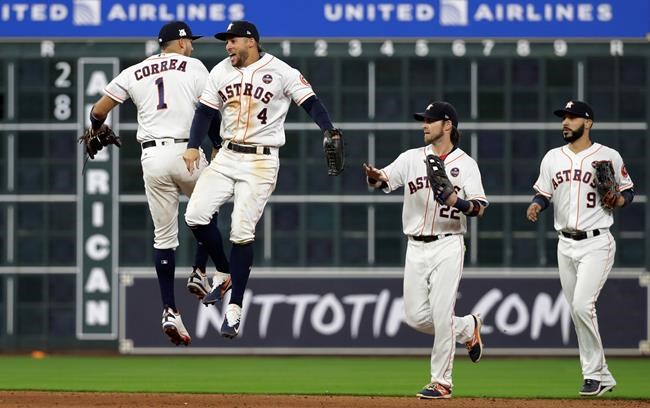 Altuve hits 3 homers, Astros beat Red Sox 8-2 in ALDS opener | iNFOnews.ca CP2078982365