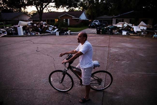 Harvey's floodwaters give way to festering piles of garbage | iNFOnews.ca