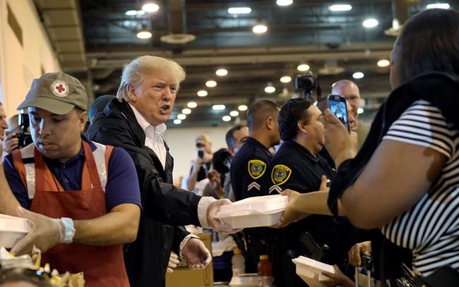Upbeat Trump pitches in at shelter for Harvey victims | iNFOnews.ca