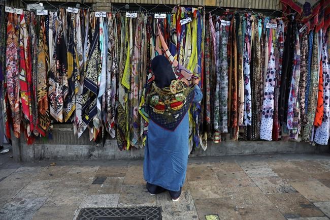 Some Iranian women take off hijabs as hard-liners push back | iNFOnews.ca CP2138030367