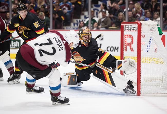 MacKinnon scores OT winner, Avs recover from blowing late lead to beat Canucks | iNFOnews.ca CP367109682