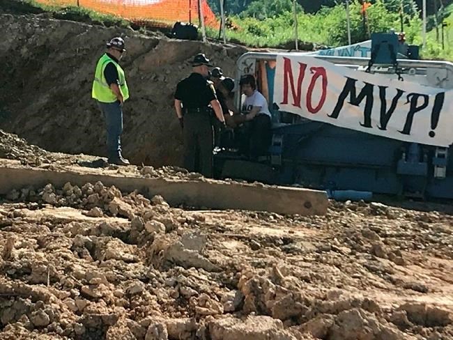 3 protesters bind selves to pipeline equipment, are arrested | iNFOnews.ca CP233662401