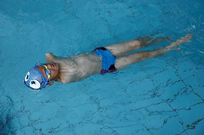 Disabled Bosnian boy beats odds to become swimming champion | iNFOnews.ca