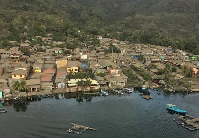 Philippine volcano alert lowered, thousands return home | iNFOnews.ca