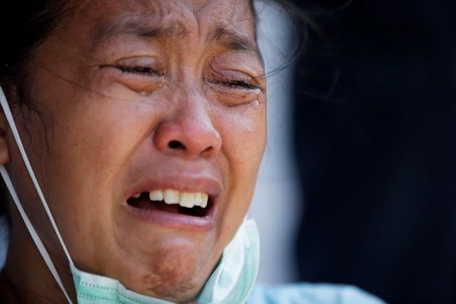 10 minutes of terror: A quake, a tsunami and a missing son | iNFOnews.ca CP218310104