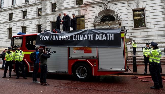 Climate activists spray fake blood on UK government building | iNFOnews.ca Climate activists spray fake blood on UK government building | iNFOnews.ca