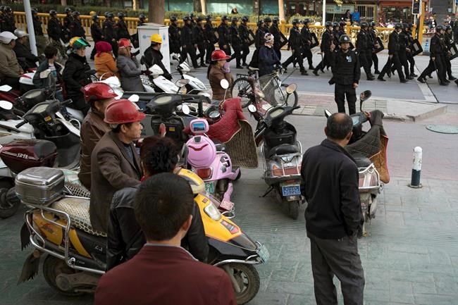 China says 13,000 Xinjiang 'terrorists' arrested since 2014 | iNFOnews.ca CP1956536774