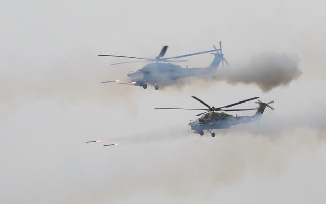 Report: Russian helicopter fires on spectators at drills | iNFOnews.ca Report: Russian helicopter fires on spectators at drills | iNFOnews.ca